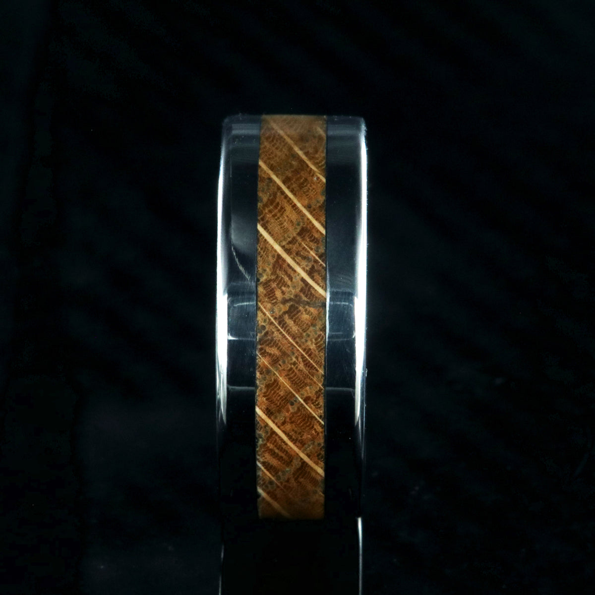 8mm wide wedding band with titanium edges and a whiskey barrel sleeve