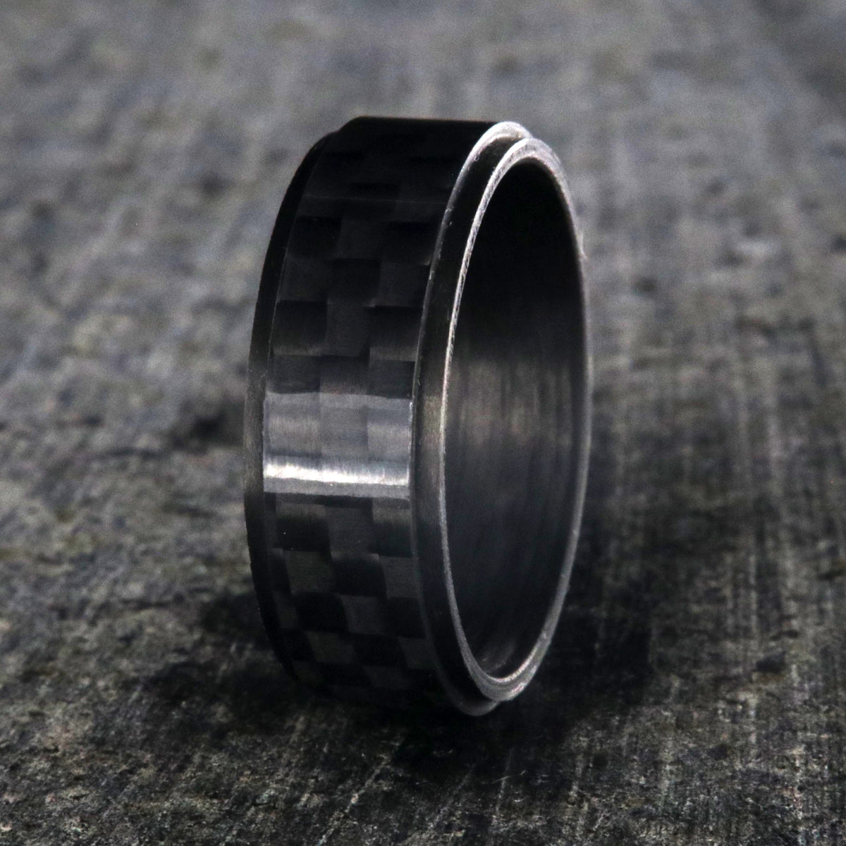 8mm wide black carbon fiber ring with a raised center and flat profile