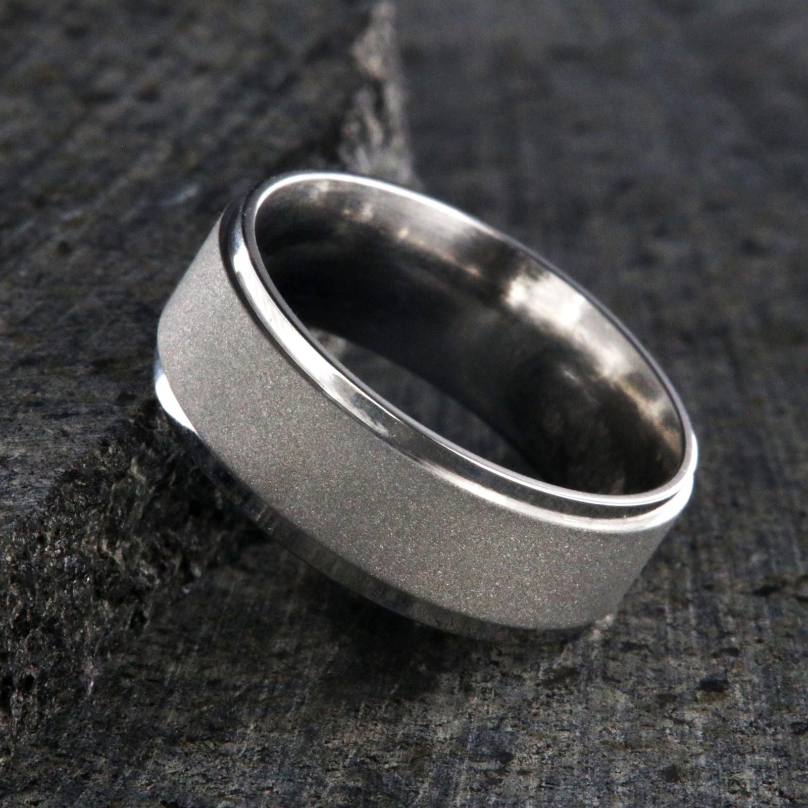 8mm wide cobalt wedding band with a raised-center and sandblasted finish