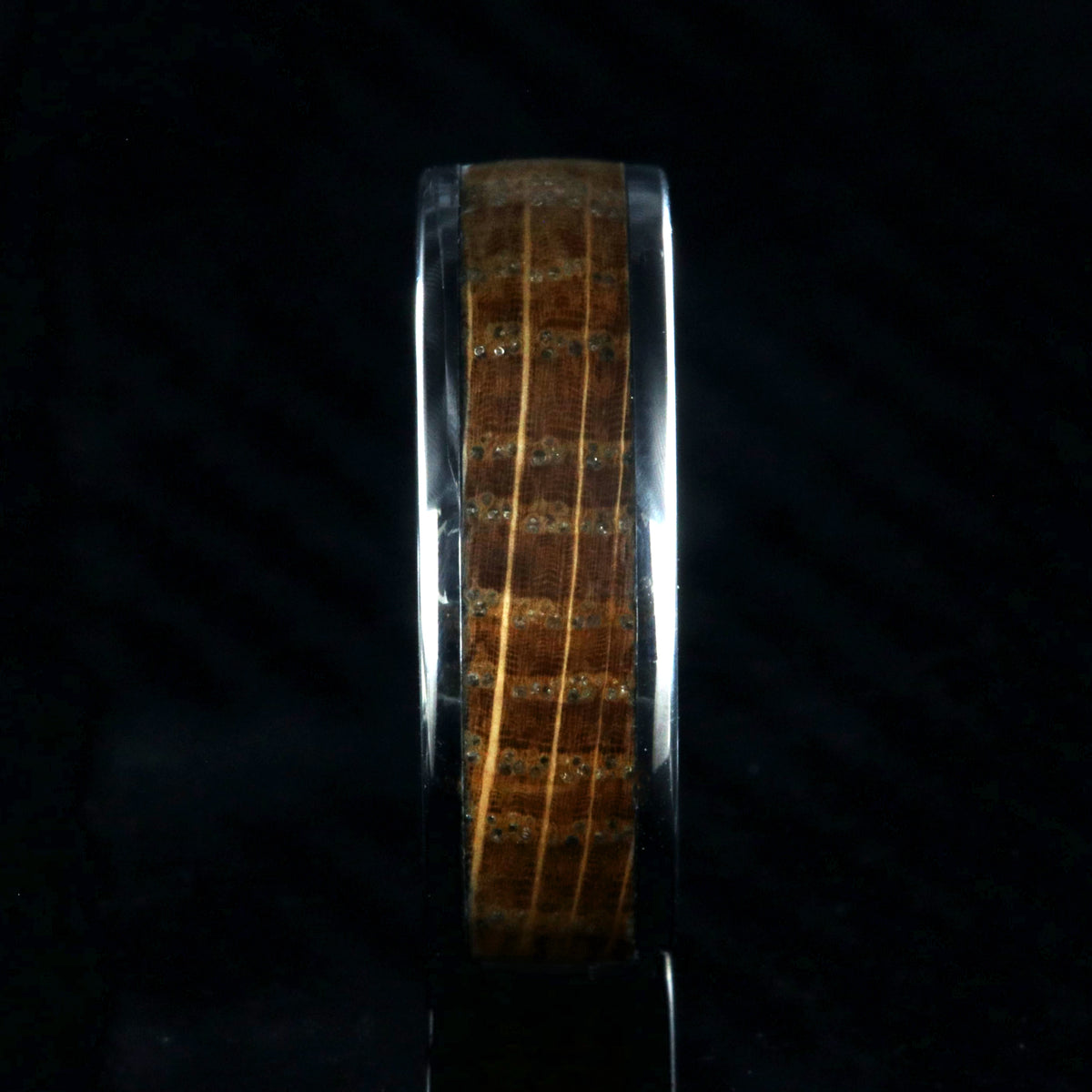 7mm wide wedding band with titanium edges and a whiskey barrel sleeve