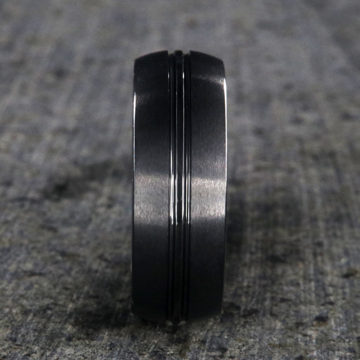 8mm wide black titanium wedding band with a center dual groove and rounded profile
