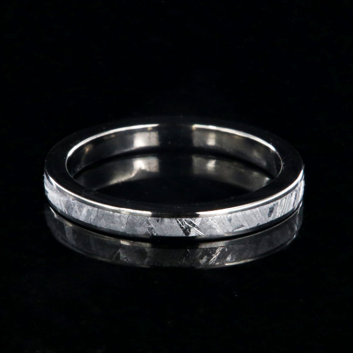 3mm wide women&#39;s meteorite wedding band with titanium edges and sleeve