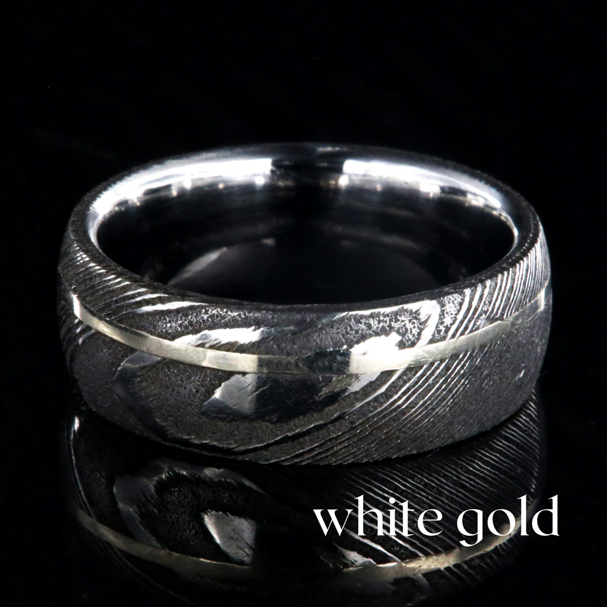 8mm wide Damascus steel ring with white gold inlay