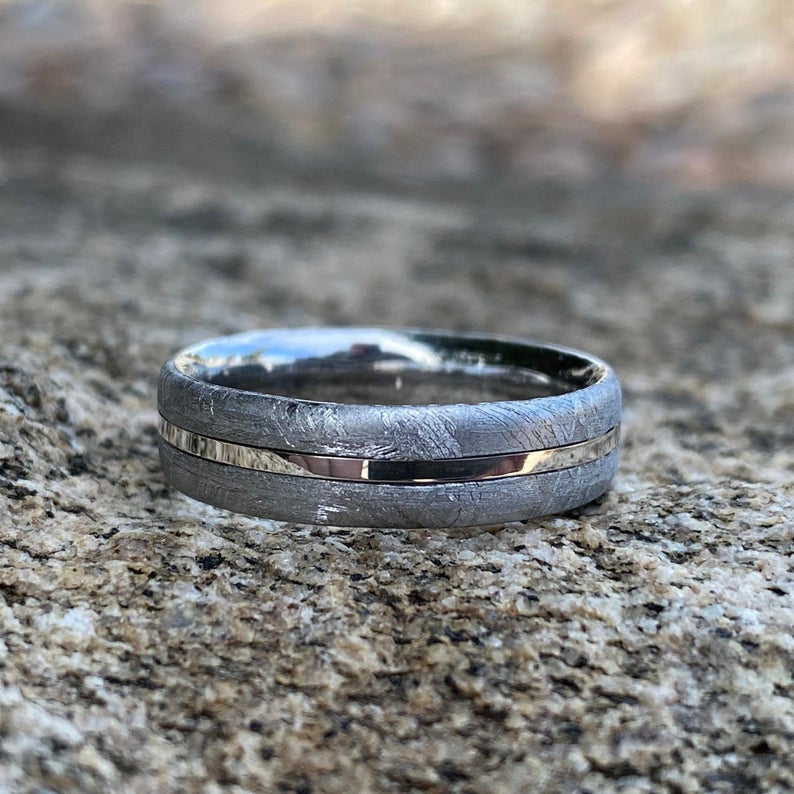 6mm wide cobalt wedding band with Gibeon meteorite on the outside, a white gold center inlay, and cobalt sleeve