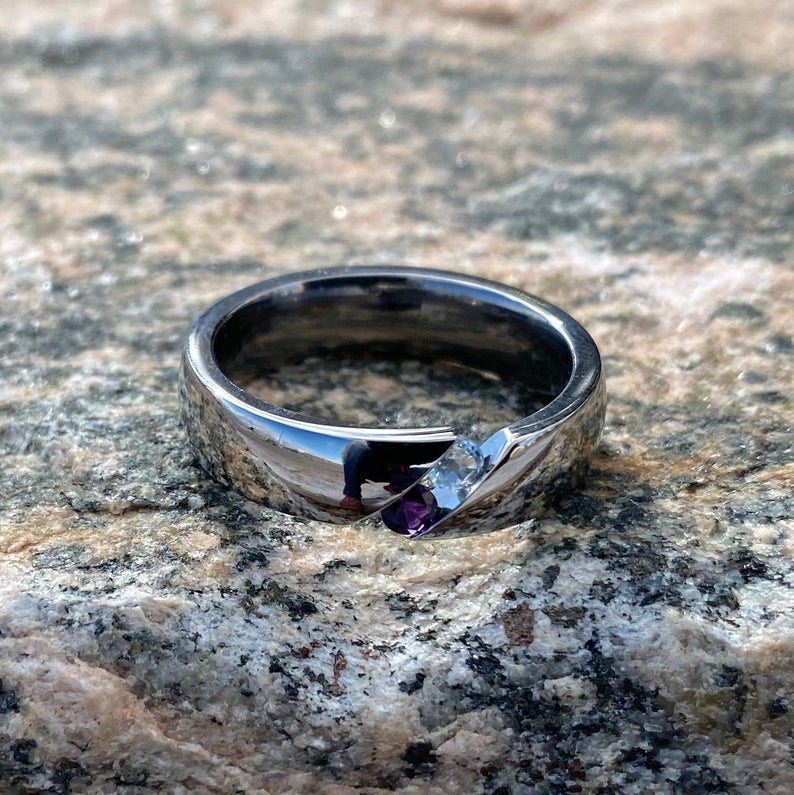 6mm wide titanium tension set ring with an amethyst and aquamarine stone