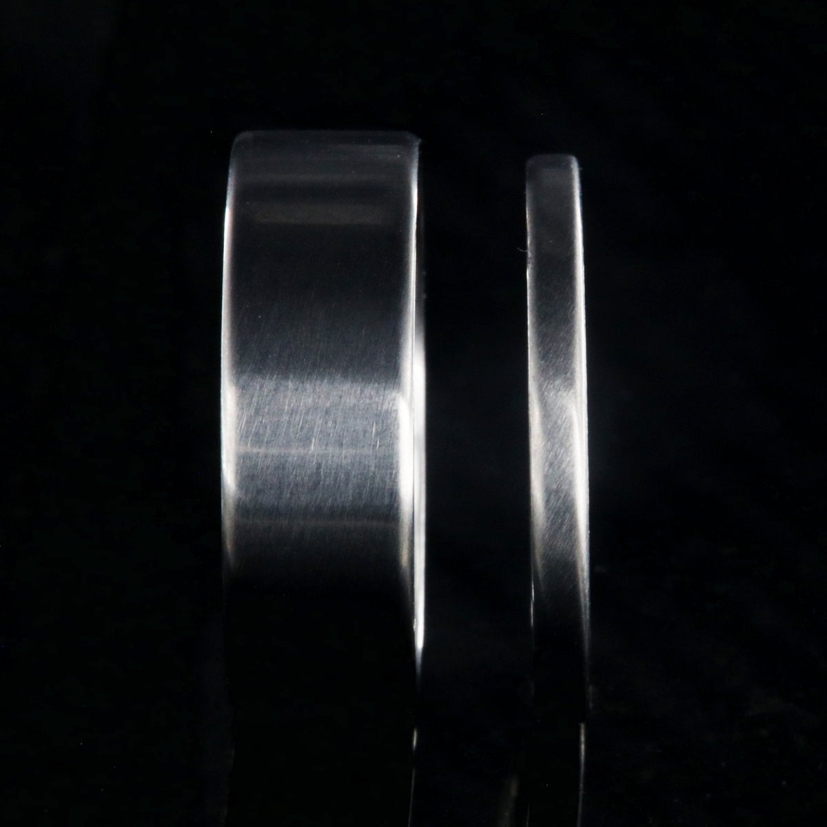 7mm and 2mm wide matching titanium wedding band set with a flat profile