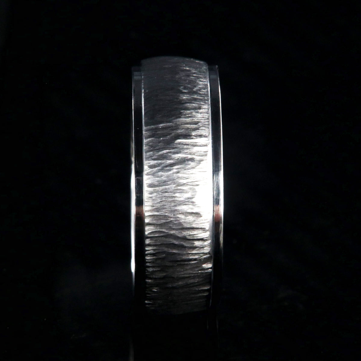 8mm wide titanium wedding band with a raised center and tree bark finish