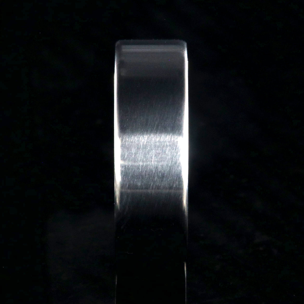 7mm wide titanium wedding band with a flat profile