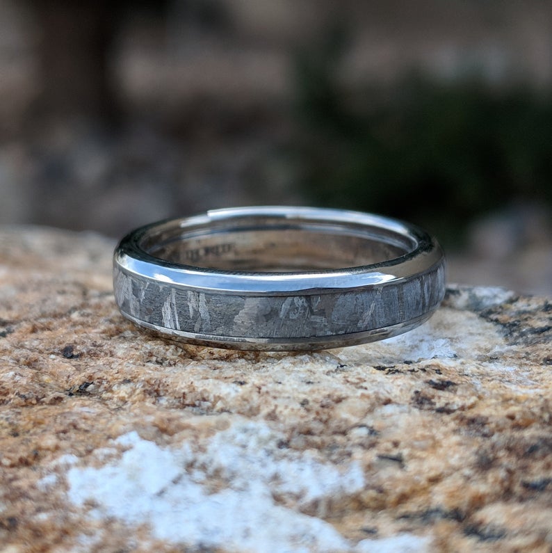 4mm wide women's meteorite wedding band with a rounded profile and titanium edges and sleeve