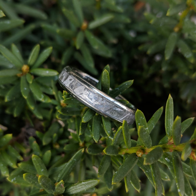 4mm wide women&#39;s meteorite wedding band with a rounded profile and titanium edges and sleeve