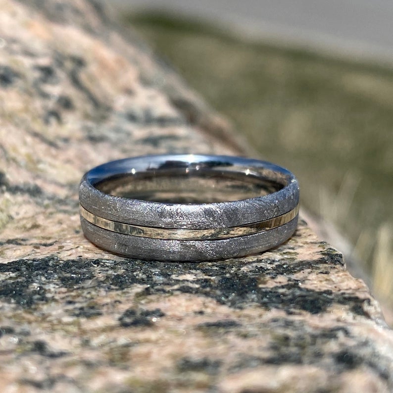 6mm wide cobalt wedding band with Gibeon meteorite on the outside, a white gold center inlay, and cobalt sleeve