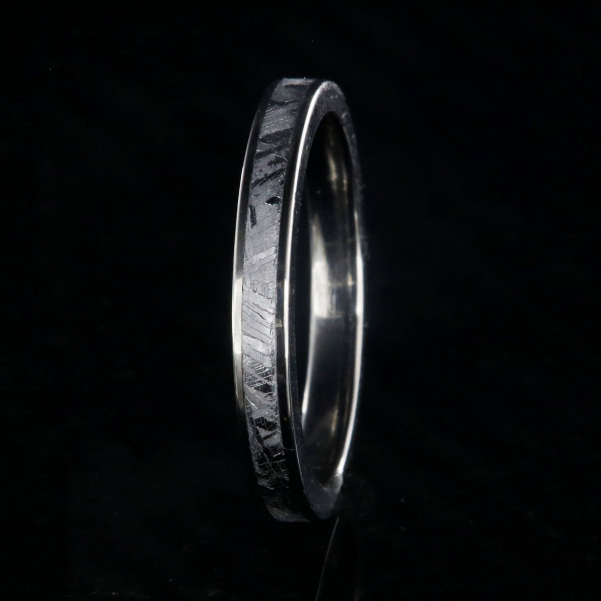 3mm wide women&#39;s meteorite wedding band with titanium edges and sleeve