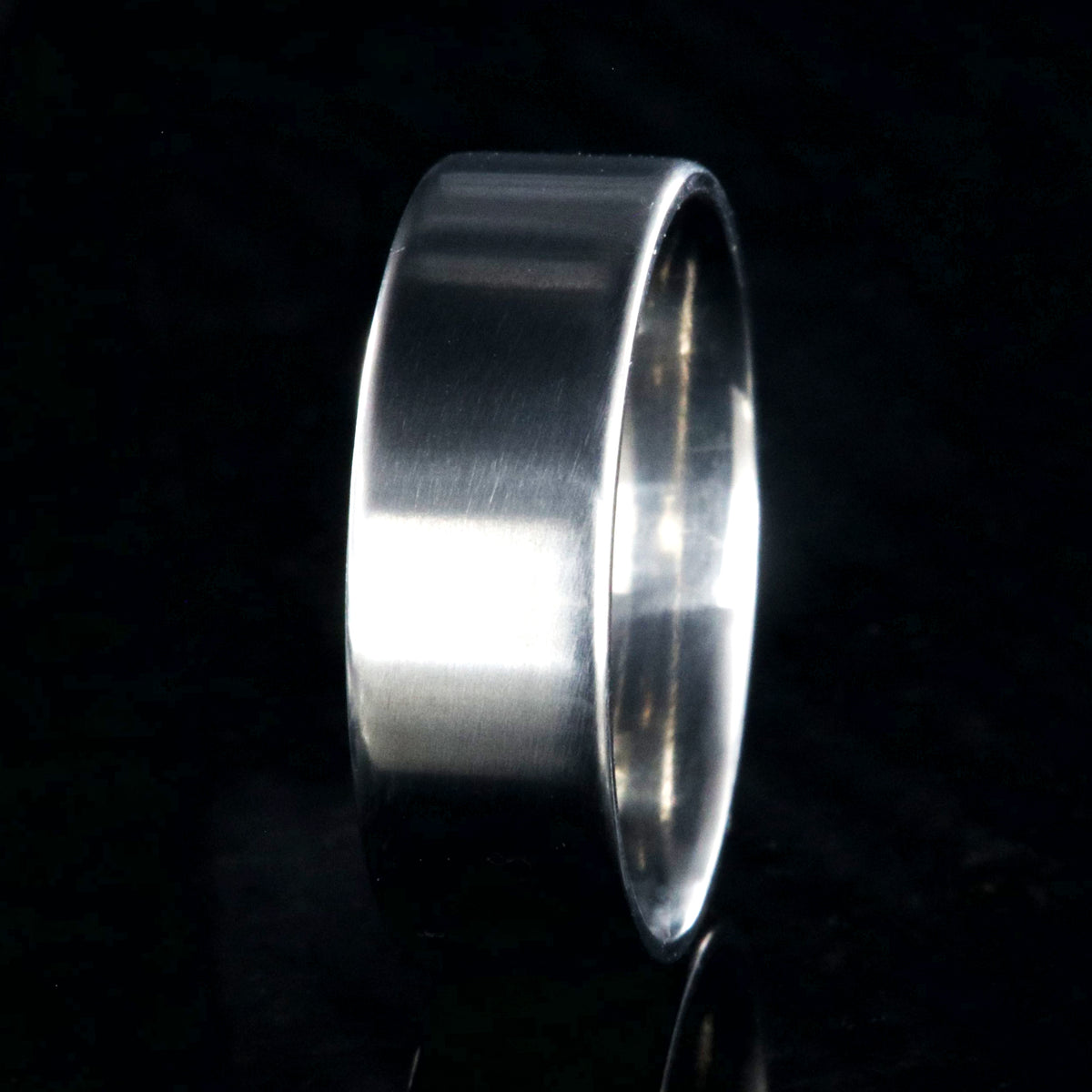 7mm wide titanium wedding band with a flat profile