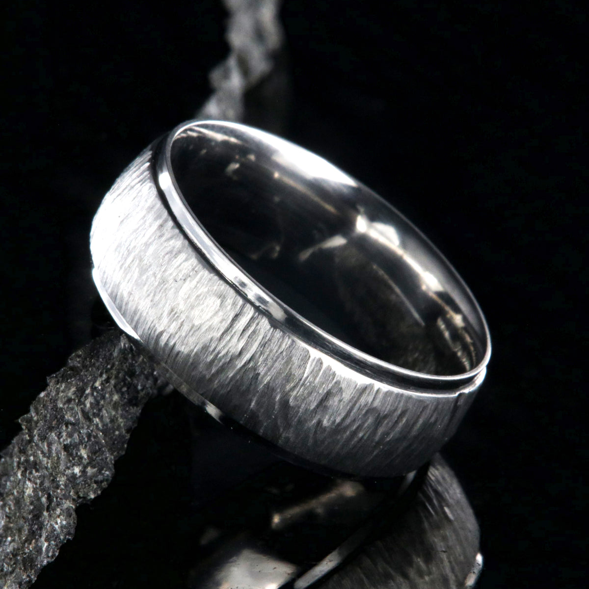 8mm wide titanium wedding band with a raised center and tree bark finish