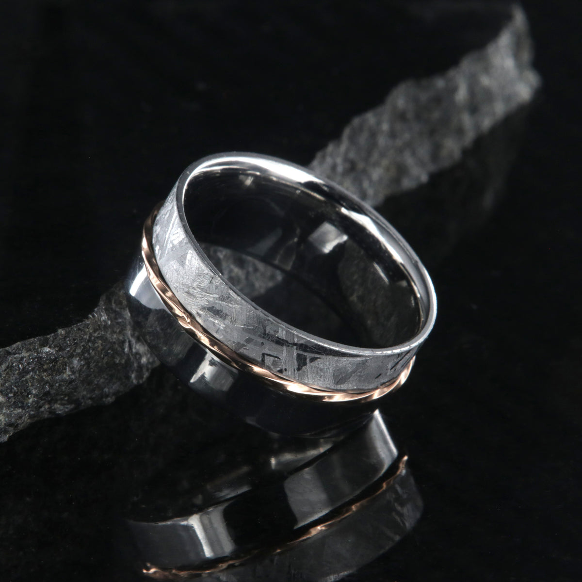 8mm wide men&#39;s wedding band with one half meteorite and the other of polish cobalt with a twisted rose gold inlay