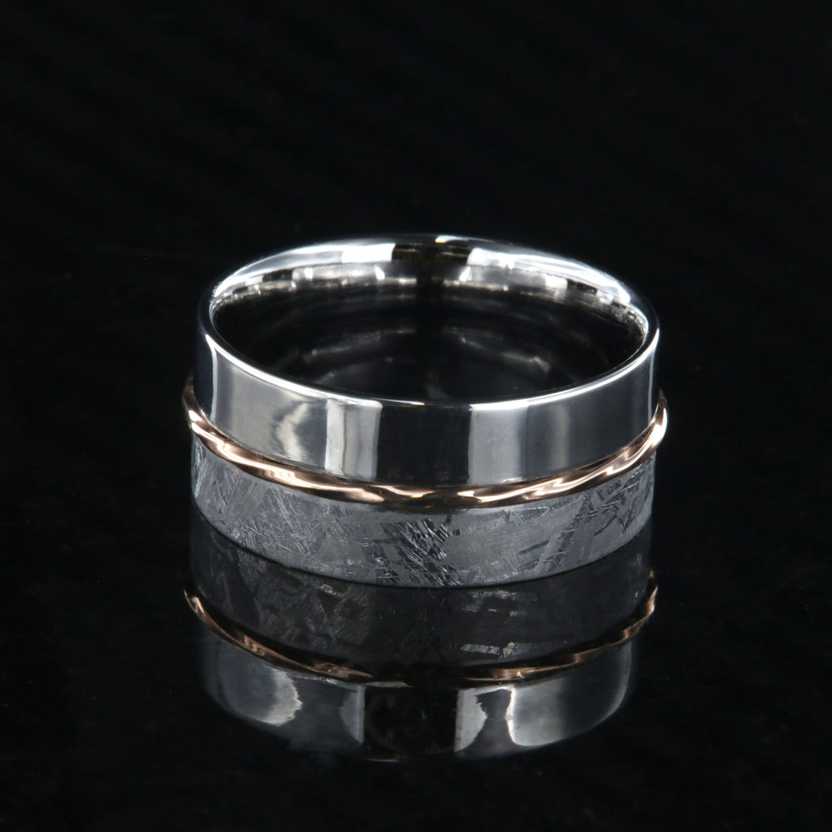 8mm wide men&#39;s wedding band with one half meteorite and the other of polish cobalt with a twisted rose gold inlay