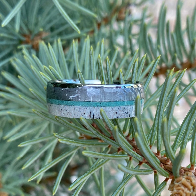 8mm wide men's wedding ring with a thin turquoise center inlay, a Gibeon meteorite edge, and an antler edge
