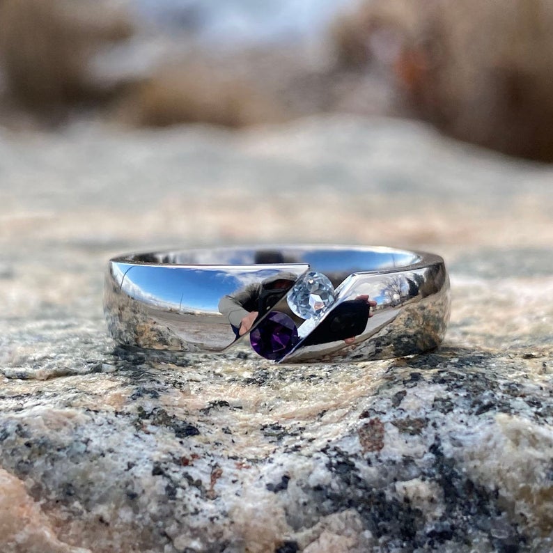 6mm wide titanium tension set ring with an amethyst and aquamarine stone