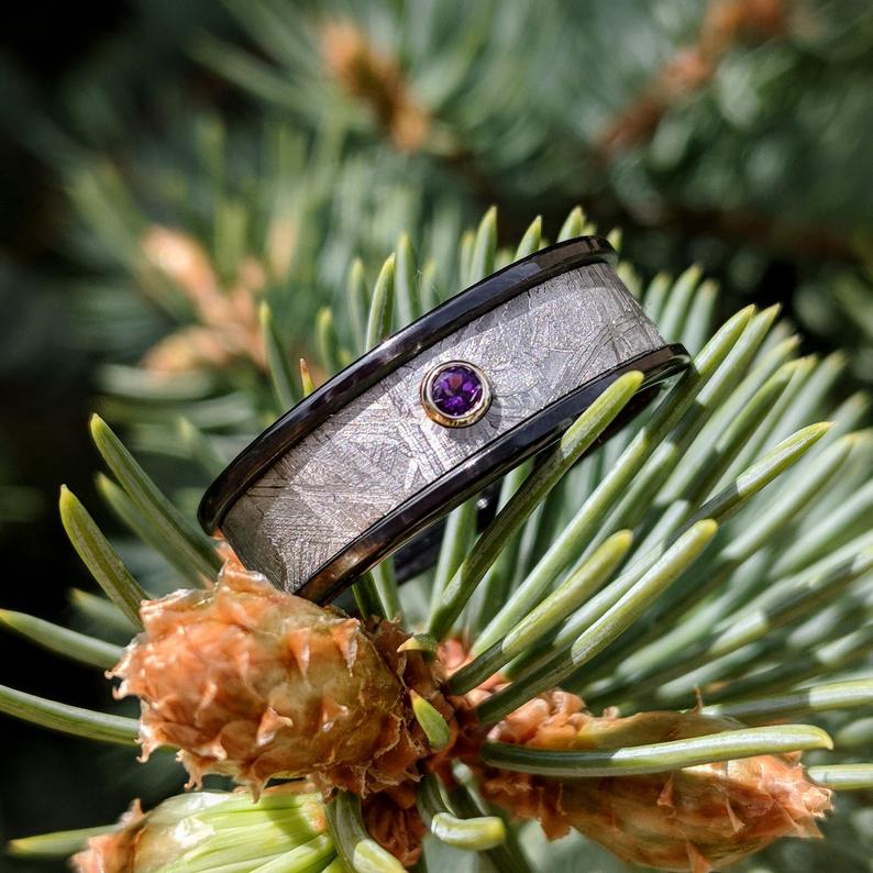 7mm wide meteorite ring with a 3mm purple amethyst stone and black zirconium edges and sleeve
