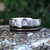 10mm wide men's wedding band with half of the ring covered in Gibeon meteorite and the other half is a double Tyrannosaurus rex fossil inlays