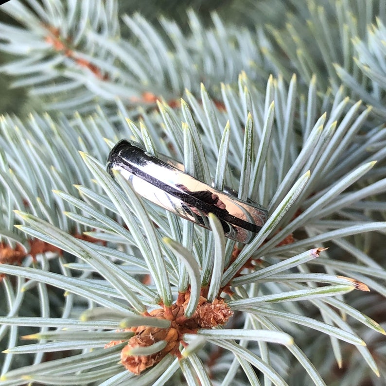 5mm wide women's stardust ring with polished cobalt edges and a thin black stardust center inlay