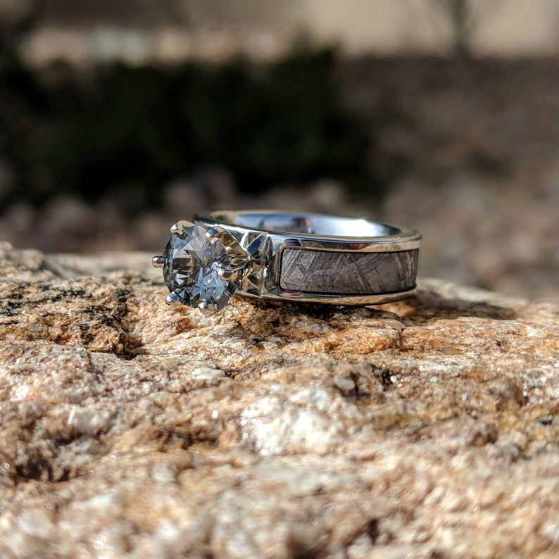 6mm wide women's meteorite engagement ring with a round aquamarine stone