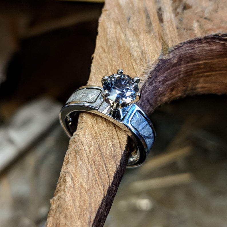 6mm wide women&#39;s meteorite engagement ring with a round aquamarine stone