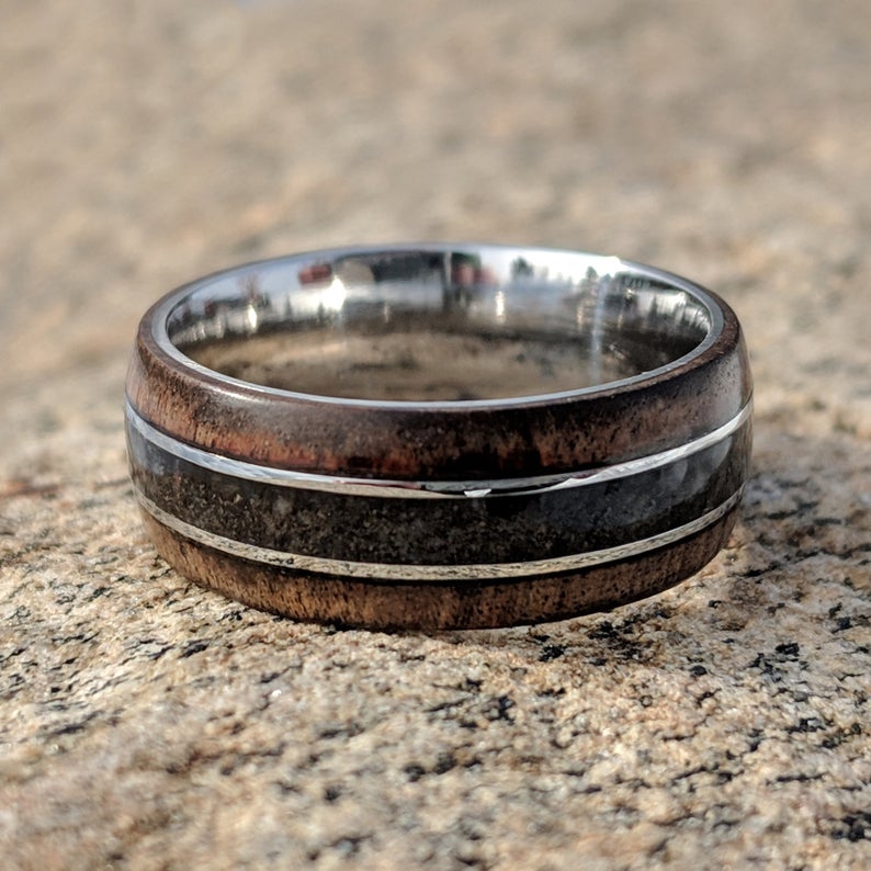 8mm wide cobalt wedding band with Arizona ironwood edges, a dinosaur bone inlay, and a rounded profile