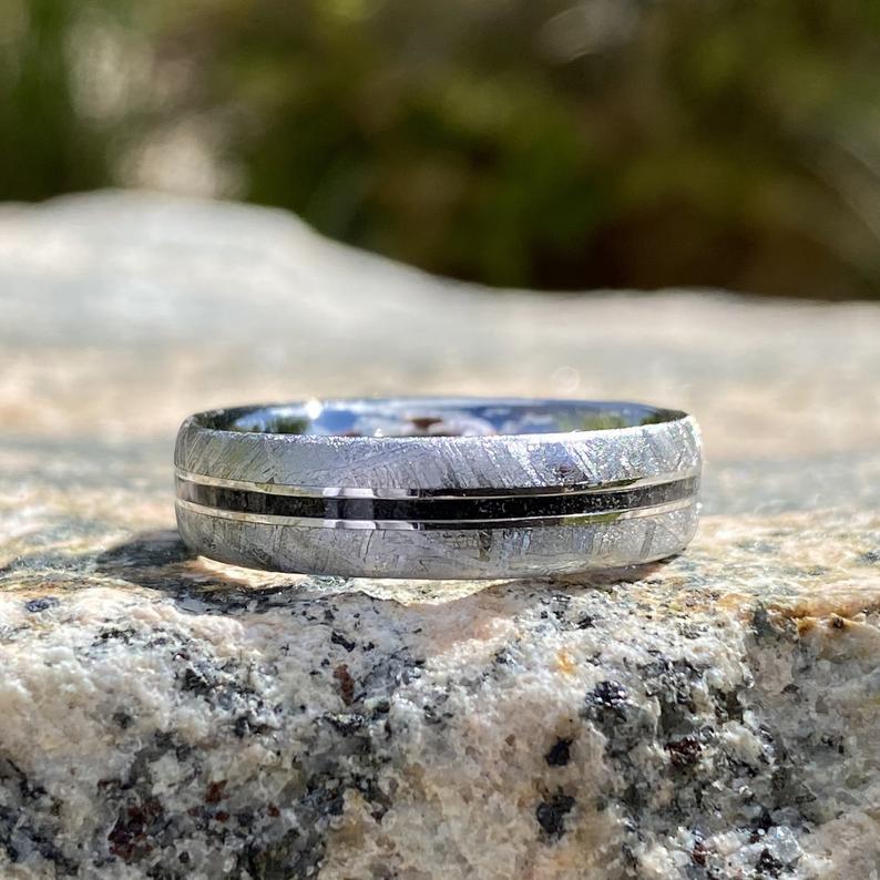 5mm wide meteorite wedding band with a black stardust center inlay 