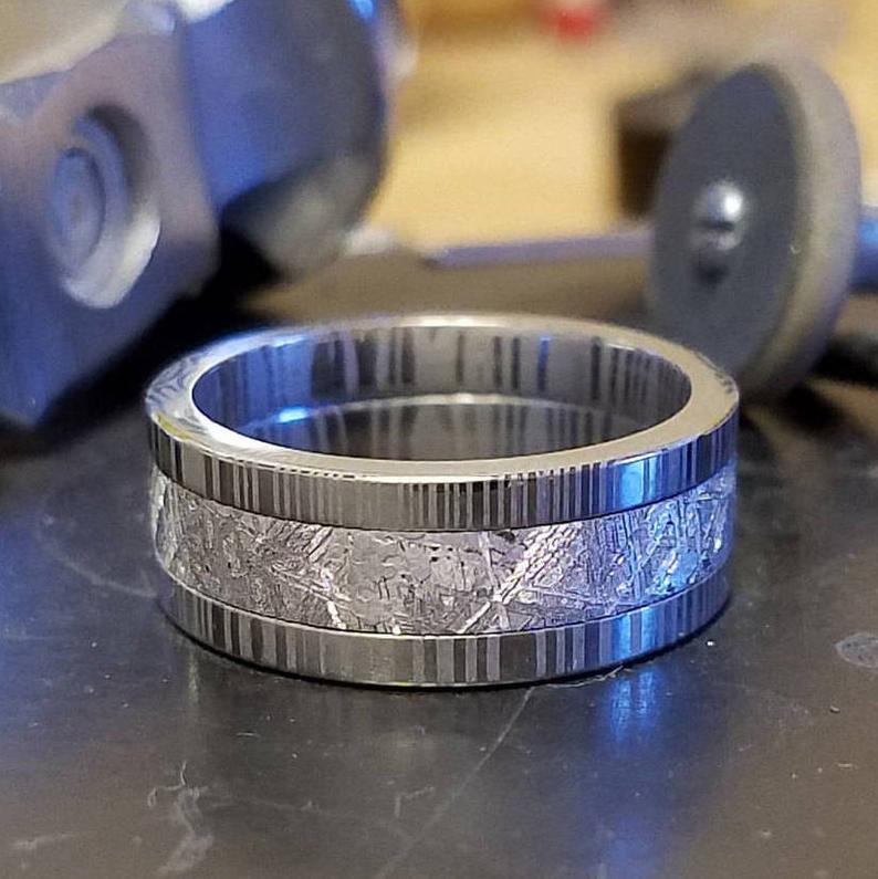8mm wide Gibeon meteorite wedding band with Damascus steel edges and sleeve