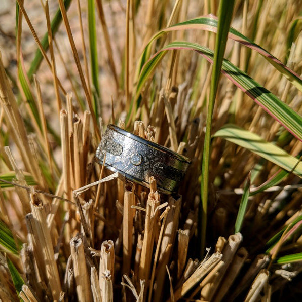 10mm wide meteorite memorial ring with 3mm center ashes and bezel set 3mm diamond 