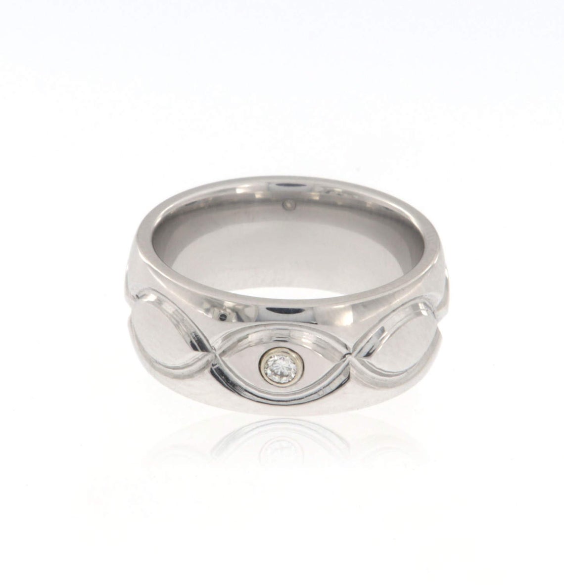 8mm wide cobalt ring with an infinity design and bezel set diamond