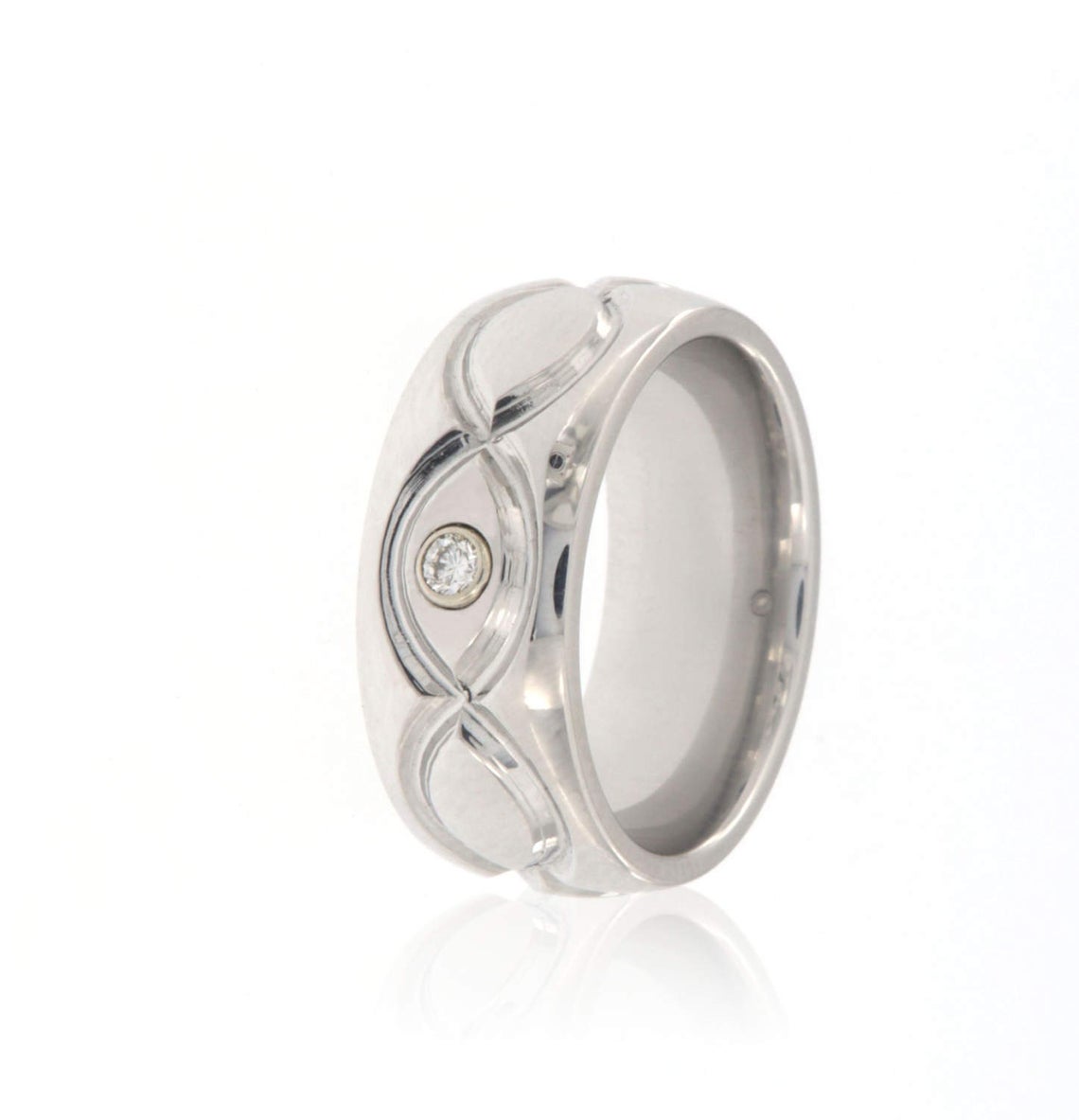 8mm wide cobalt ring with an infinity design and bezel set diamond