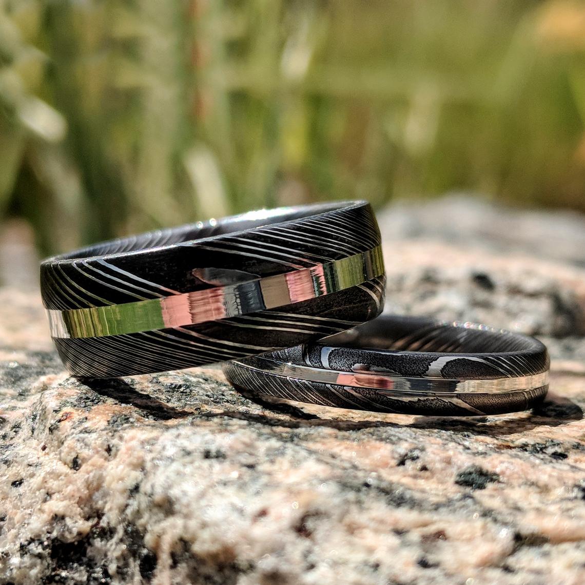 8mm wide and 4mm wide Damascus steel wedding ring set with centered sterling silver inlay