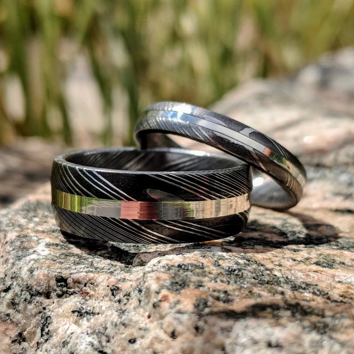 8mm wide and 4mm wide Damascus steel wedding ring set with centered sterling silver inlay