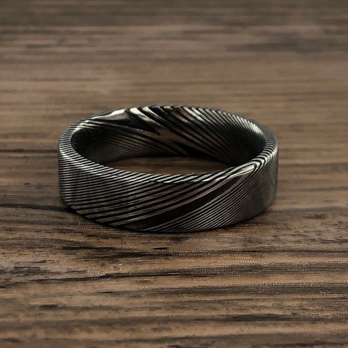 6mm wide Damascus steel wedding band with a flat profile