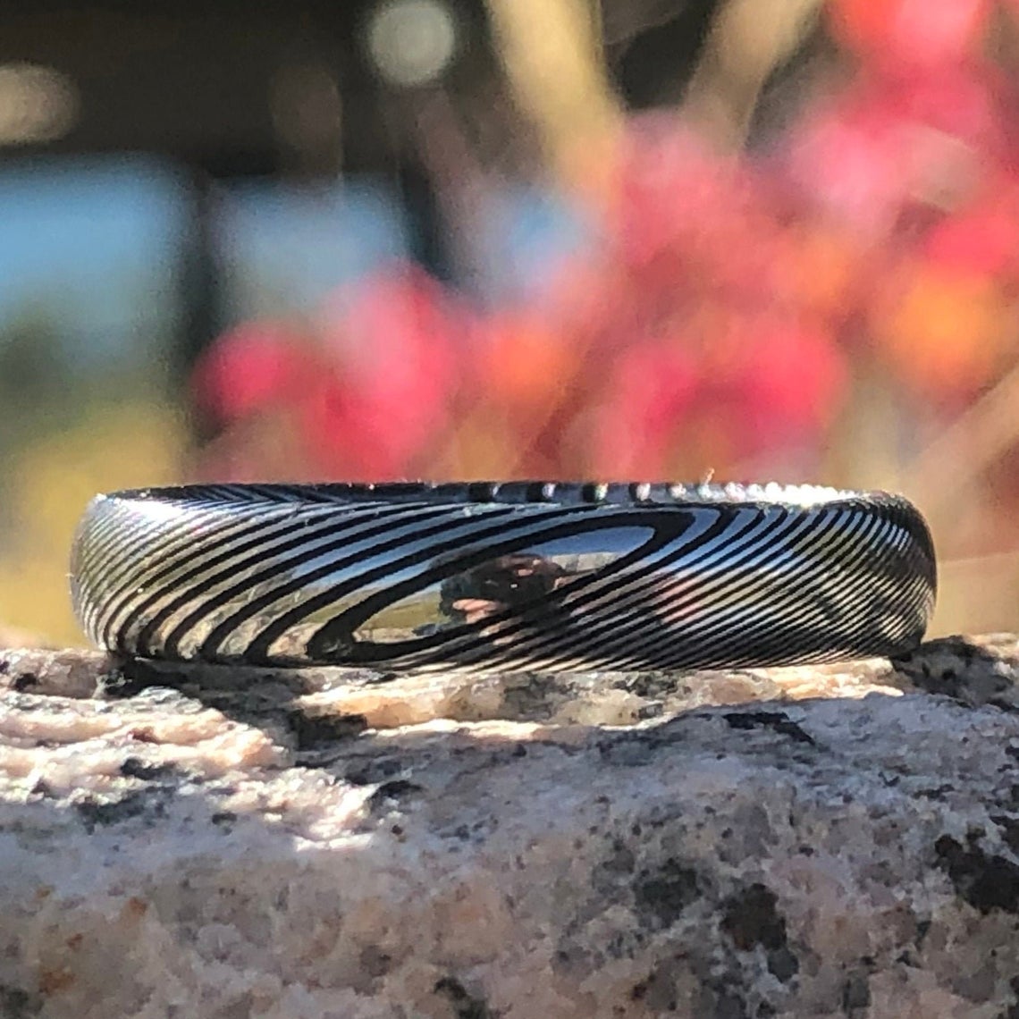 4mm wide Damascus steel wedding band with a rounded profile