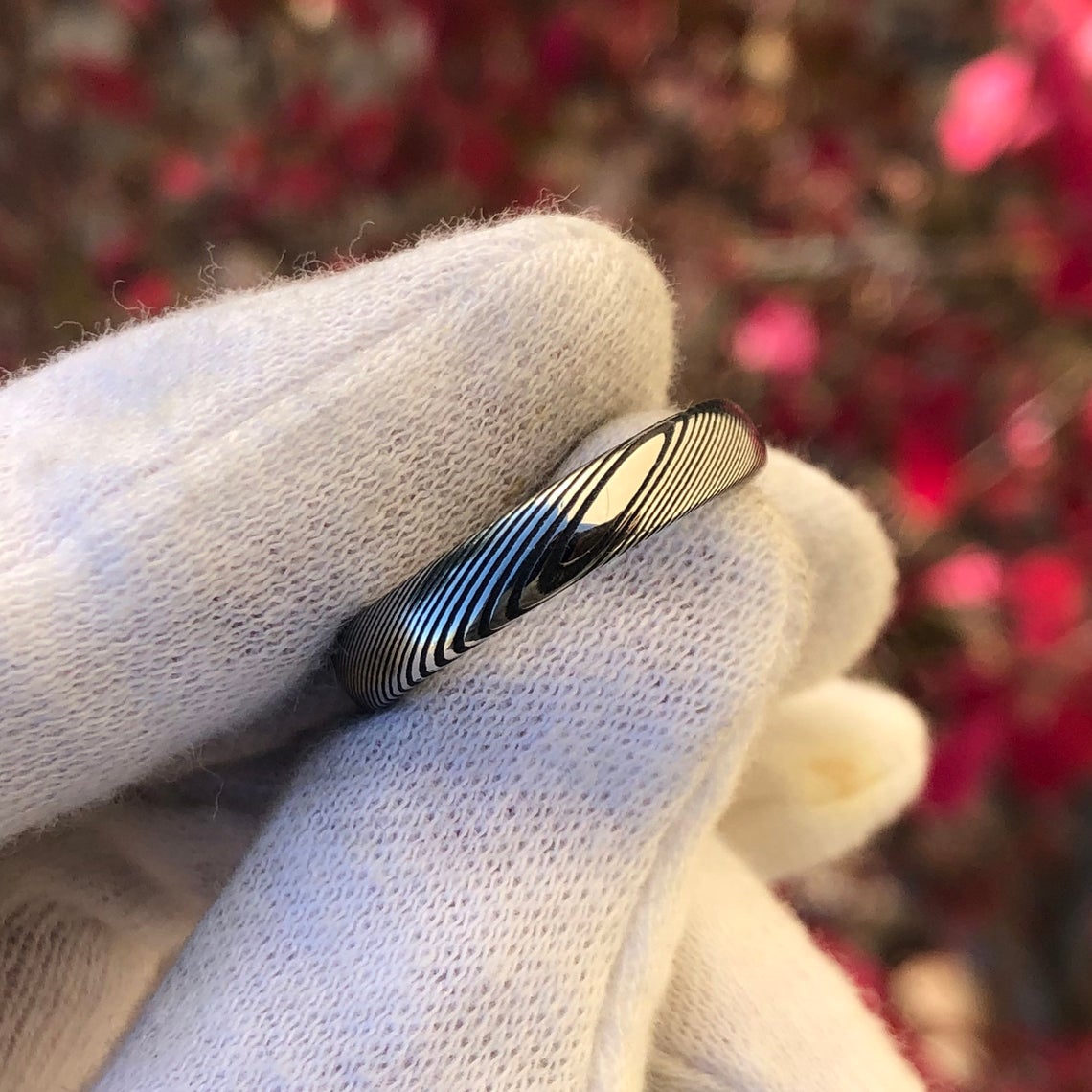 4mm wide Damascus steel wedding band with a rounded profile