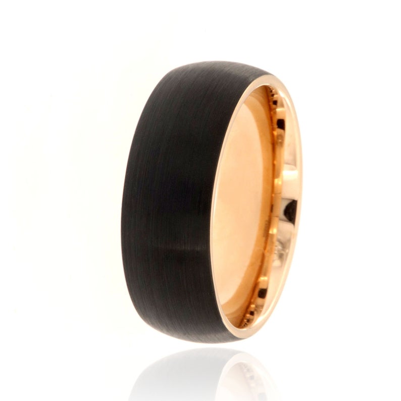 8mm wide tungsten ring with a rose gold sleeve and black outside
