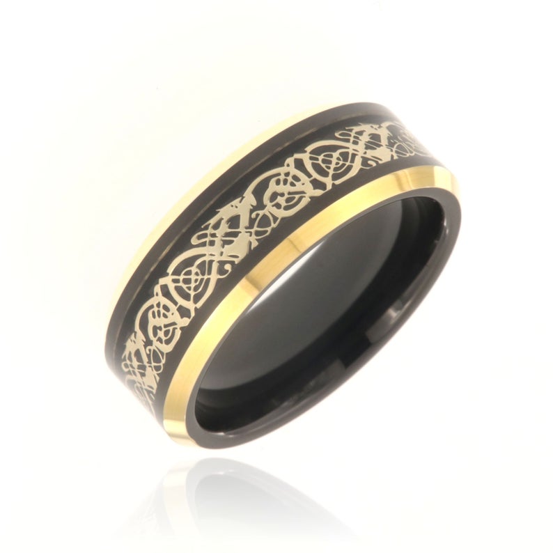 8mm wide black tungsten ring with a gold Celtic earth design
