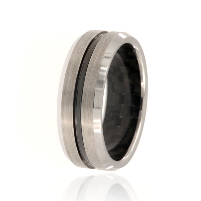 8mm wide tungsten ring with a black center inlay and a black carbon fiber sleeve